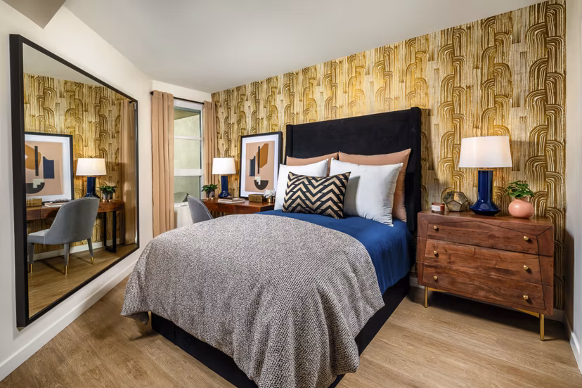Spacious bedroom with modern dÃ©cor at Rae on Sunset Apartments in a luxurious setting