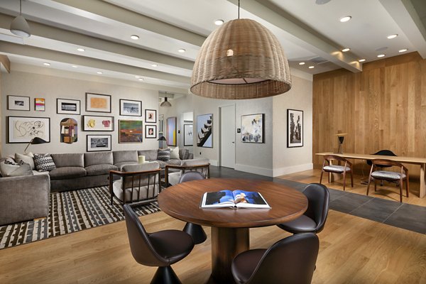 Clubhouse with modern decor at Rae on Sunset Apartments luxury community in prime location