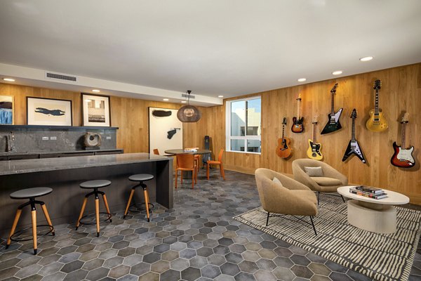 Clubhouse featuring modern design and comfortable seating at Rae on Sunset Apartments in West Hollywood