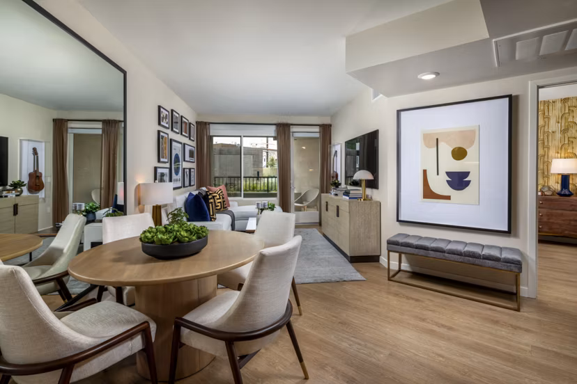 Dining area with modern furnishings at Rae on Sunset Apartments in luxury Greystar collection
