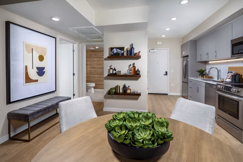 Stylish dining area with contemporary furniture at Rae on Sunset Apartments