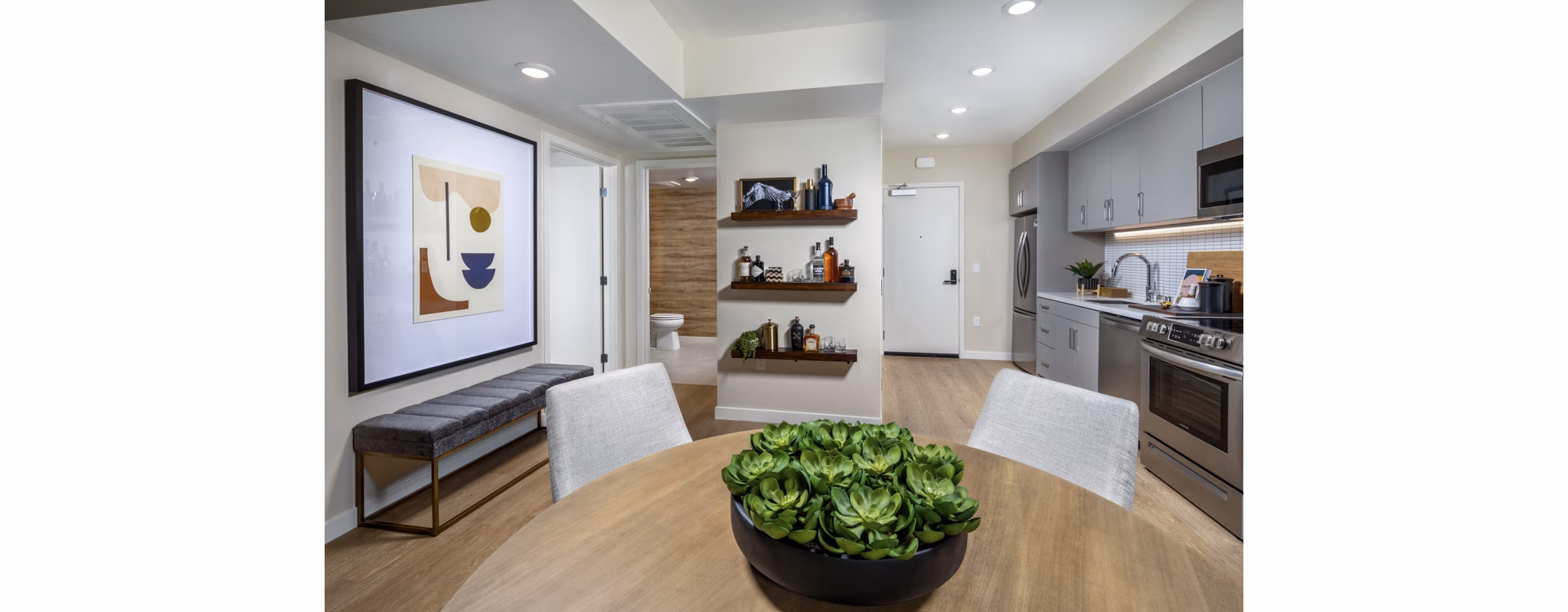 Stylish dining area with contemporary furniture at Rae on Sunset Apartments