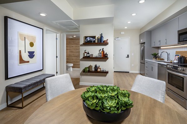 Stylish dining area with contemporary furniture at Rae on Sunset Apartments