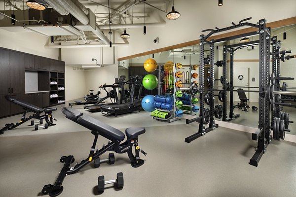 Modern fitness center with advanced equipment at Rae on Sunset Apartments in Los Angeles