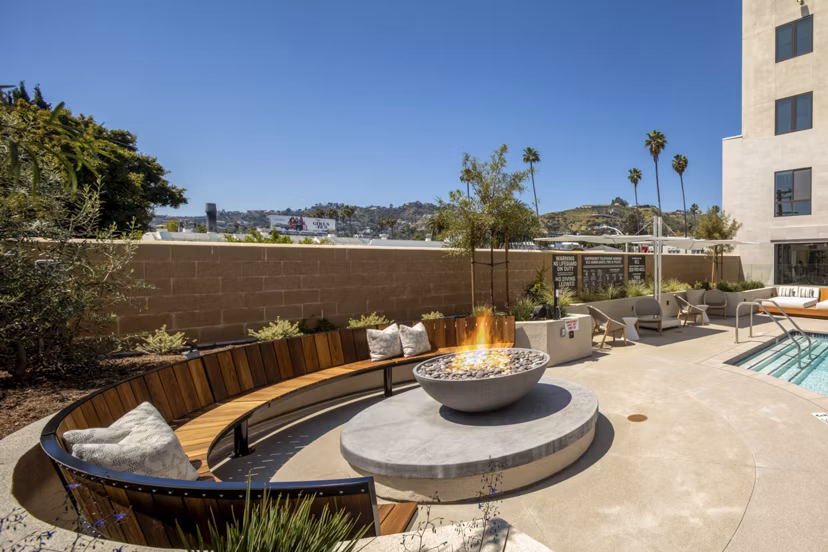 Fire pit lounge area at Rae on Sunset Apartments, luxury community in Los Angeles offering upscale outdoor amenities