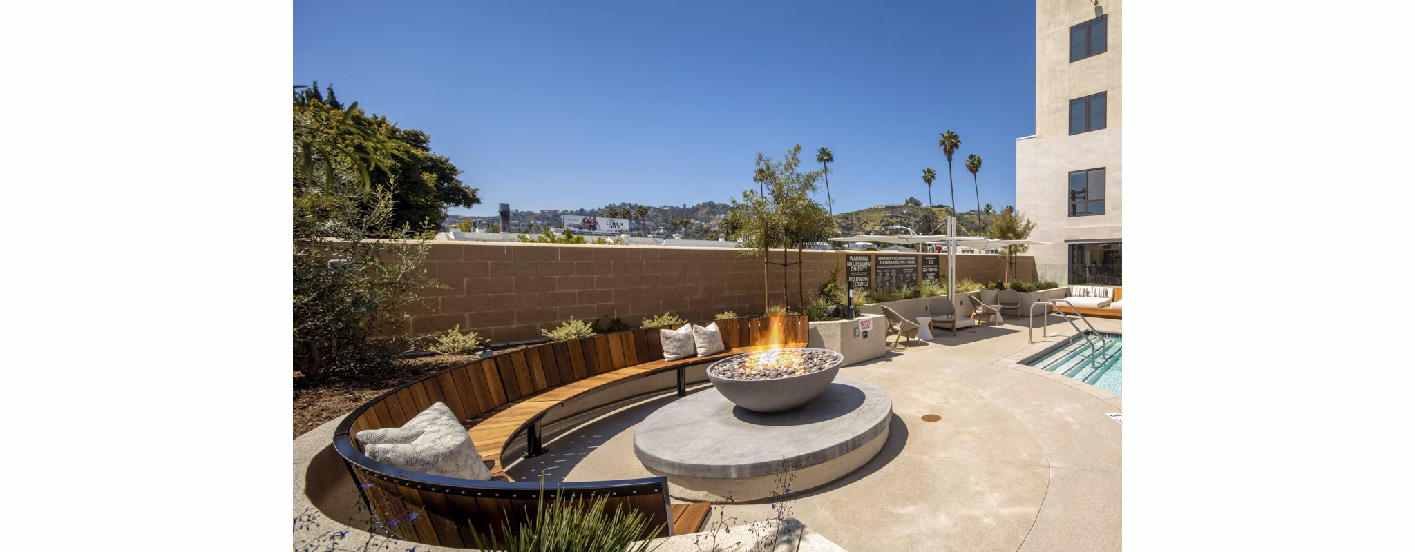 Fire pit lounge area at Rae on Sunset Apartments, luxury community in Los Angeles offering upscale outdoor amenities