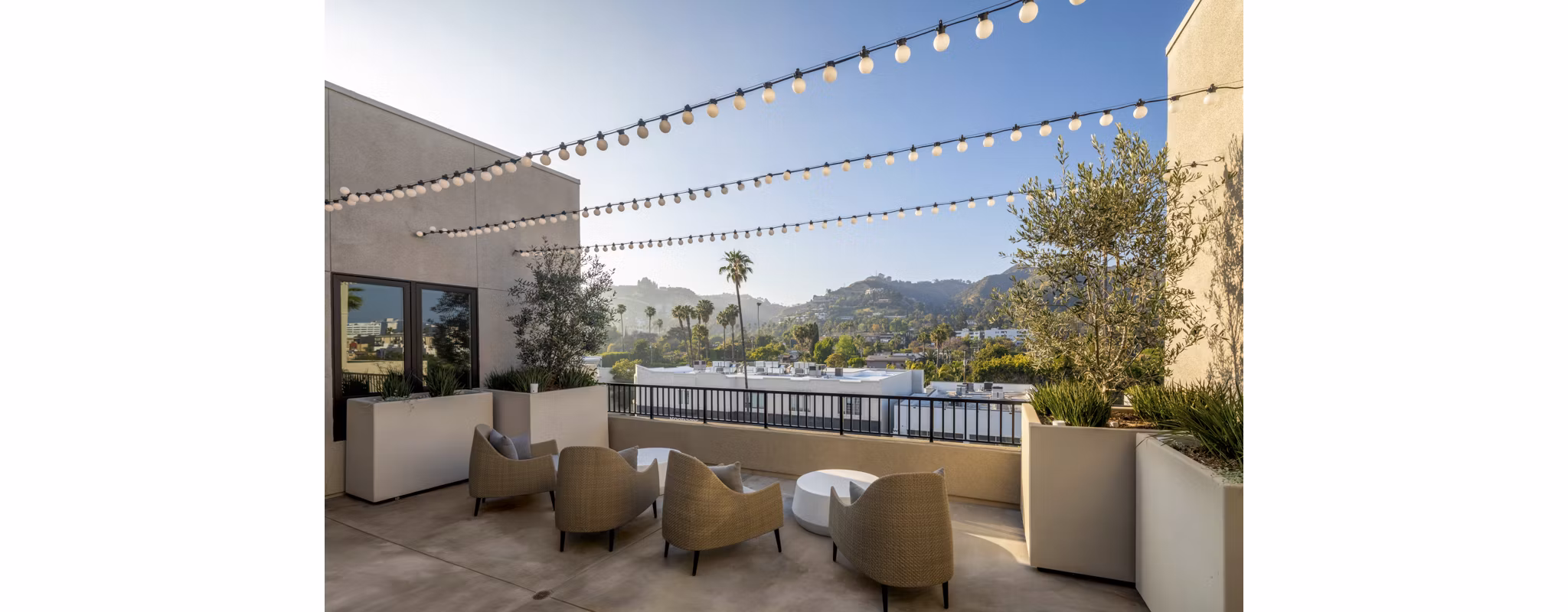 Rooftop deck with cityscape views at Rae on Sunset Apartments