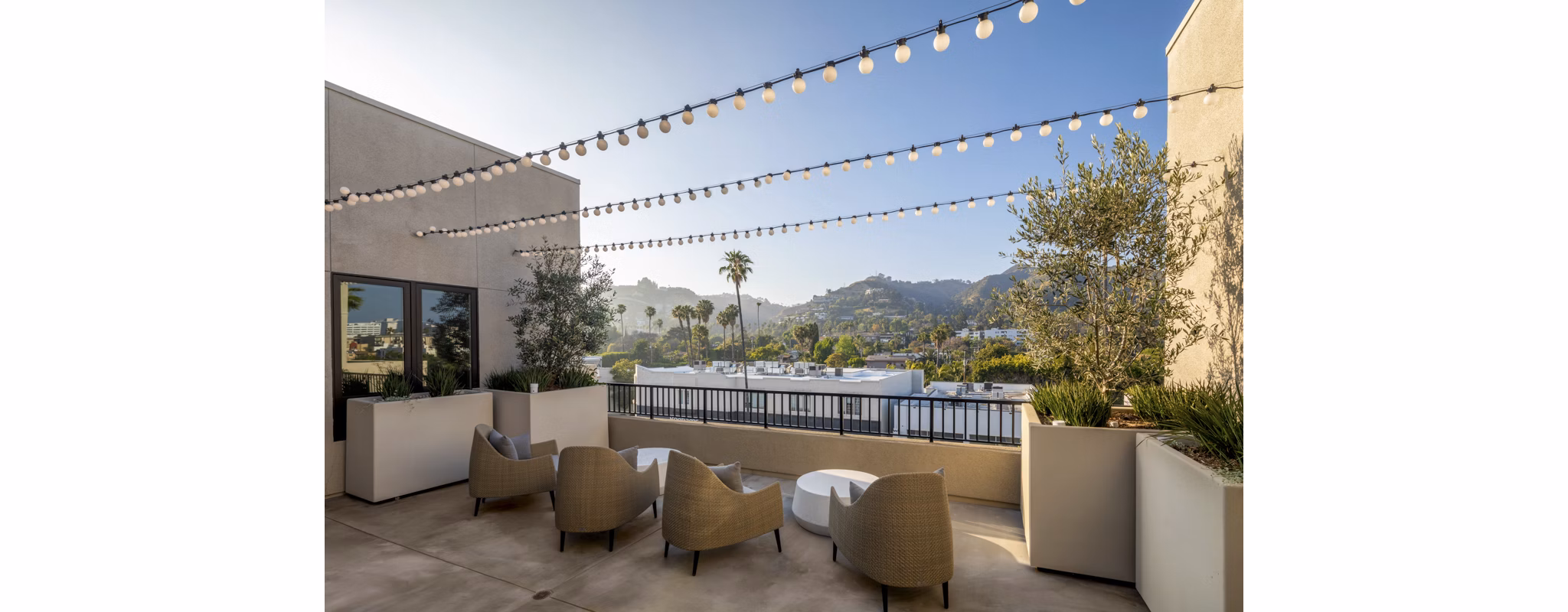 Rooftop deck with cityscape views at Rae on Sunset Apartments