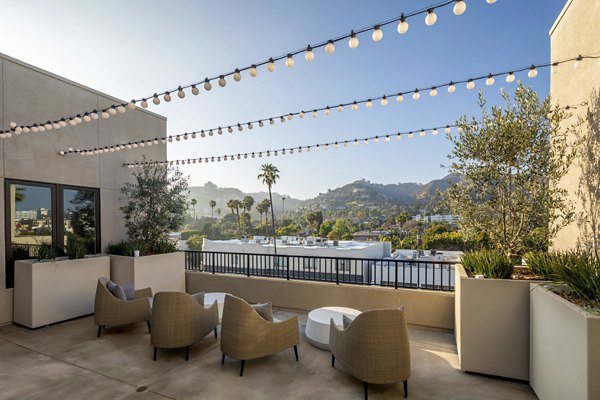 Rooftop deck with cityscape views at Rae on Sunset Apartments