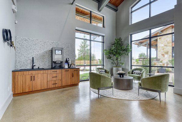 Clubhouse with stylish seating and billiards at Tacara Gruene Apartments
