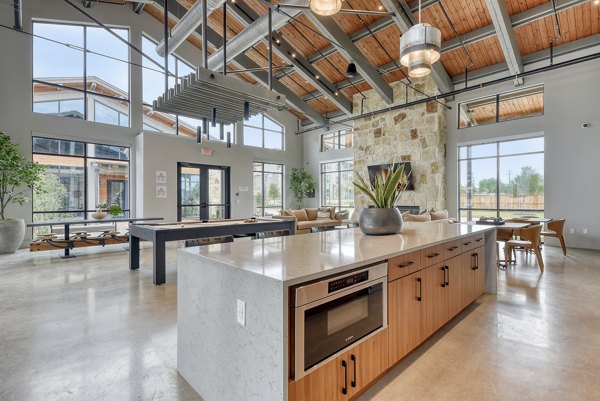 Clubhouse with modern decor and seating at Tacara Gruene Apartments