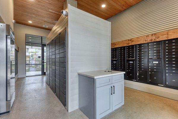Modern mail room with secure parcel lockers at Tacara Gruene Apartments