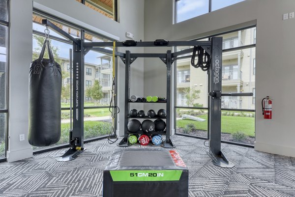 Well-equipped fitness center at Tacara Gruene Apartments featuring modern gym equipment for luxury wellness