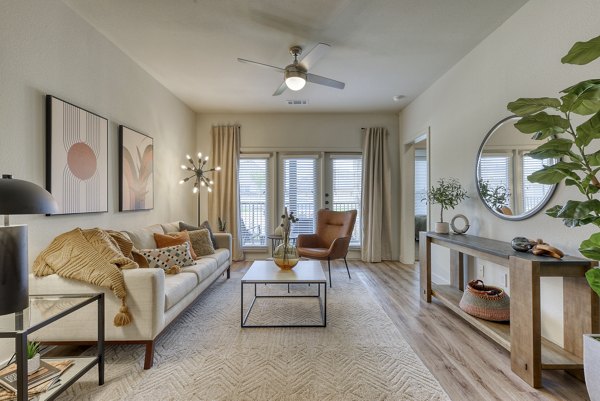 Spacious living room with modern decor in Tacara Gruene Apartments