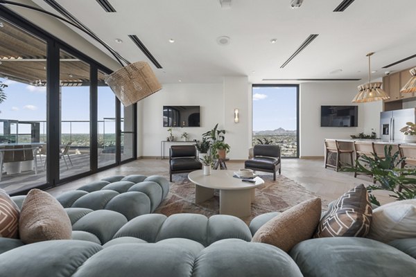 Stylish clubhouse featuring modern seating and entertainment options at Moontower PHX Apartments