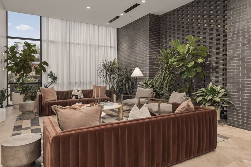 Clubhouse featuring modern decor and seating at Moontower PHX Apartments in Phoenix, offering a luxury community experience
