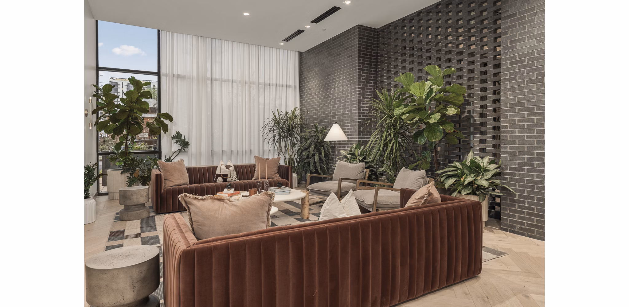 Clubhouse featuring modern decor and seating at Moontower PHX Apartments in Phoenix, offering a luxury community experience