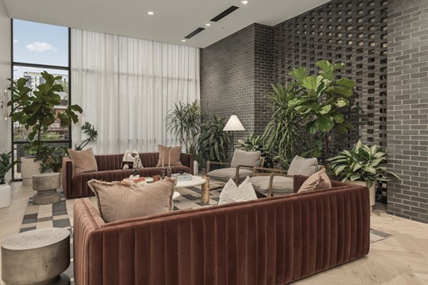 Clubhouse featuring modern decor and seating at Moontower PHX Apartments in Phoenix, offering a luxury community experience
