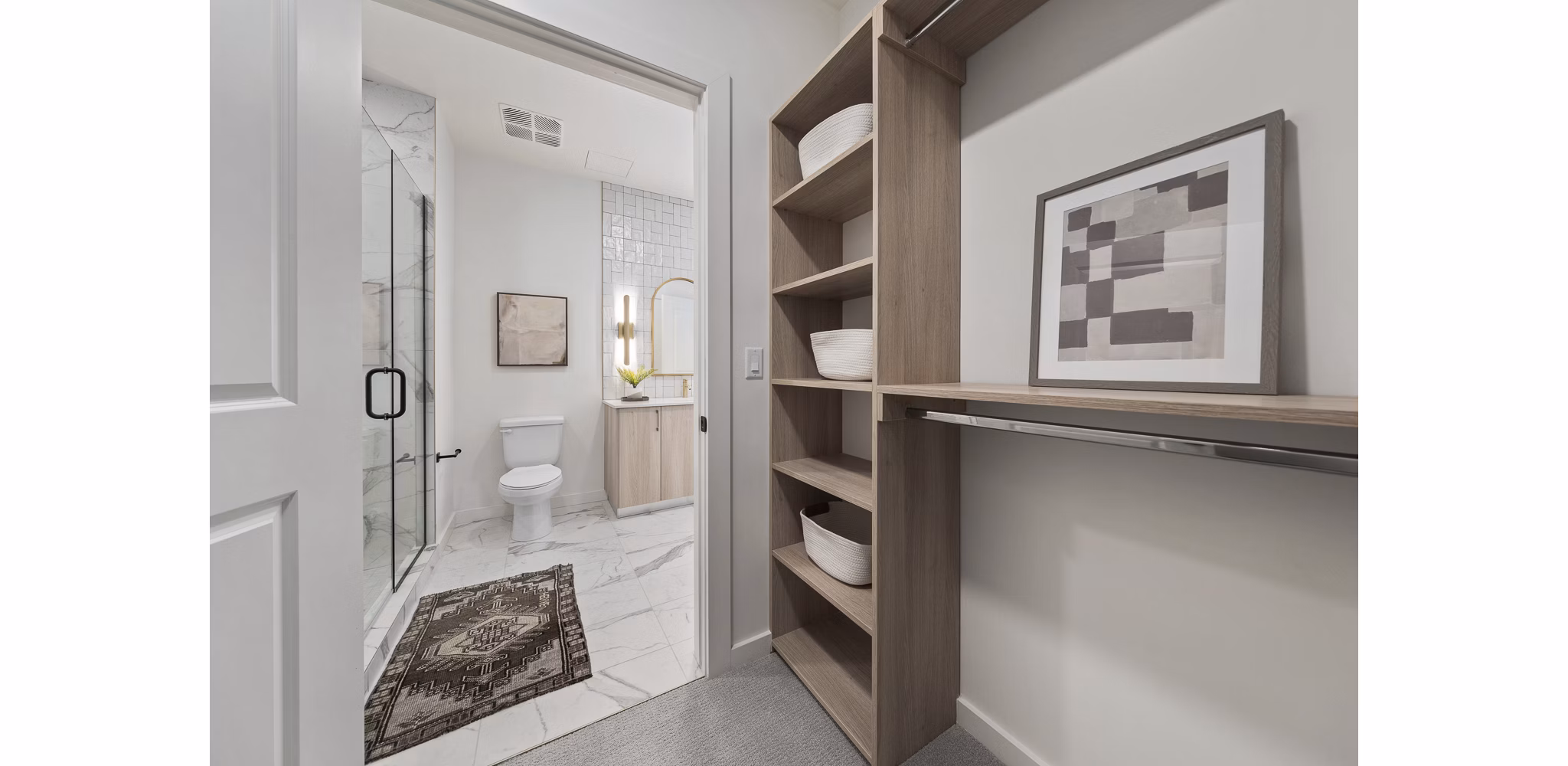 Bright hallway with modern lighting and artwork at Moontower PHX Apartments