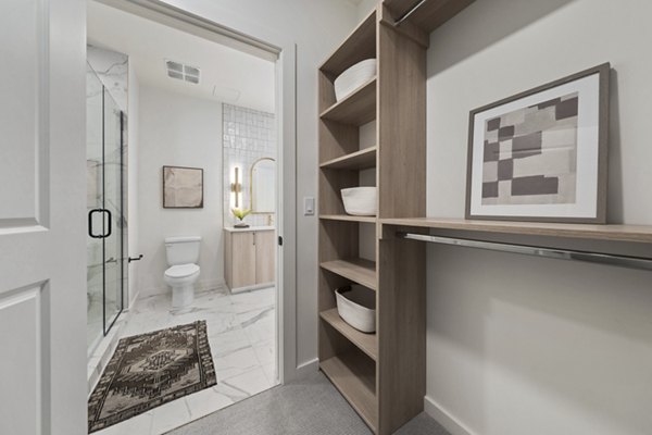 Bright hallway with modern lighting and artwork at Moontower PHX Apartments
