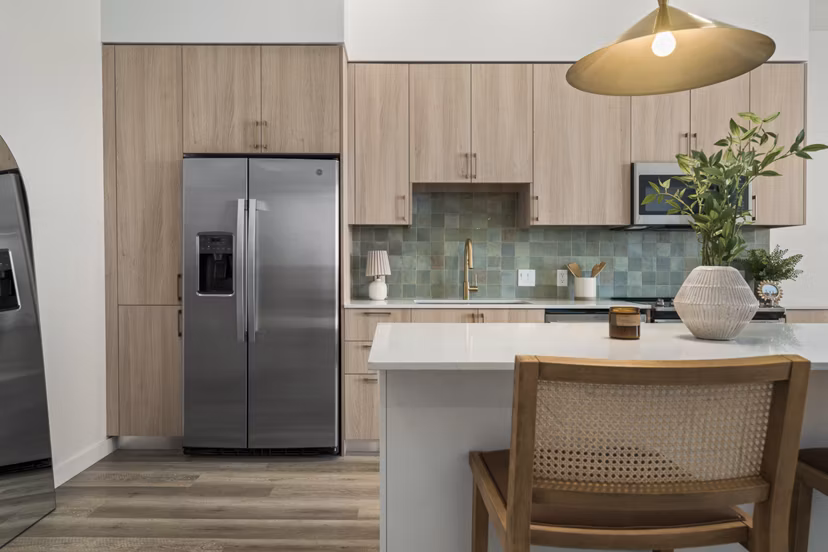 Modern kitchen with stainless steel appliances in Moontower PHX Apartments, luxury living in Phoenix