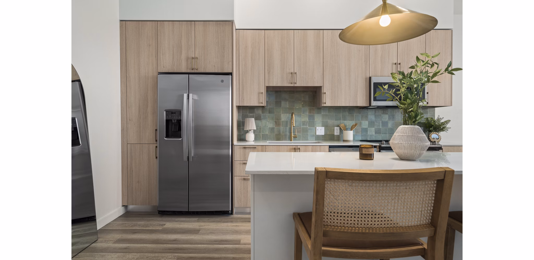 Modern kitchen with stainless steel appliances in Moontower PHX Apartments, luxury living in Phoenix