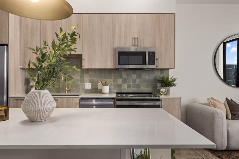Modern kitchen with stainless steel appliances at Moontower PHX Apartments