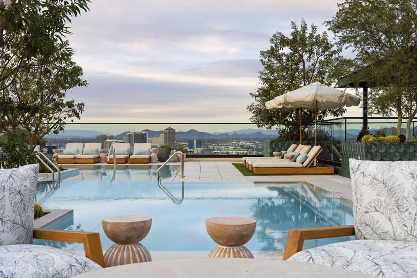 Relaxing rooftop pool with skyline views at Moontower PHX Apartments