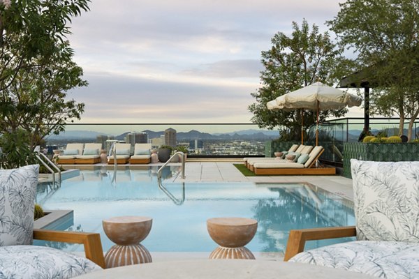 Relaxing rooftop pool with skyline views at Moontower PHX Apartments