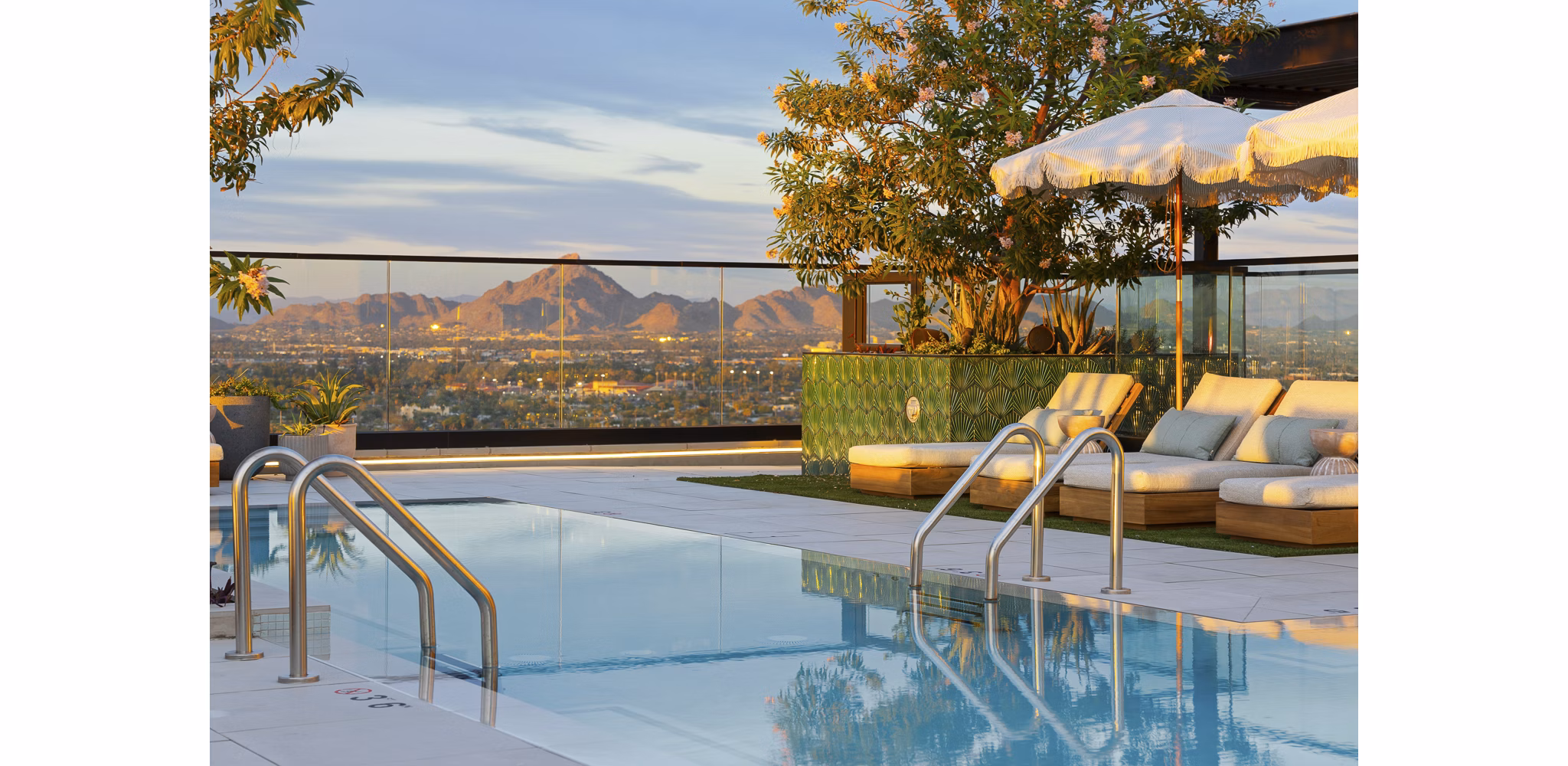 Rooftop pool with skyline views at Moontower PHX Apartments