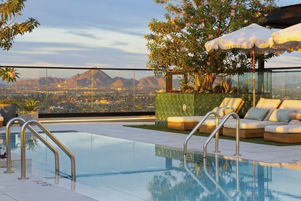 Rooftop pool with skyline views at Moontower PHX Apartments