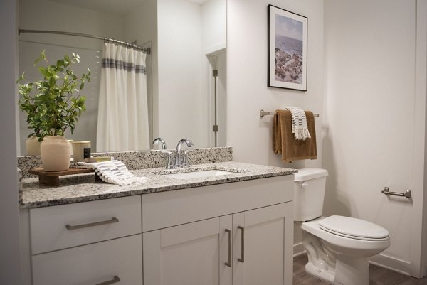 Elegant bathroom with modern fixtures at The Whitby luxury apartments, showcasing sleek design and premium finishes