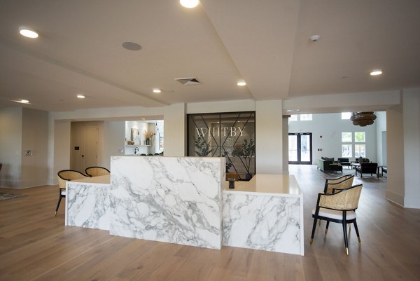Clubhouse featuring modern decor and plush seating at The Whitby luxury apartments