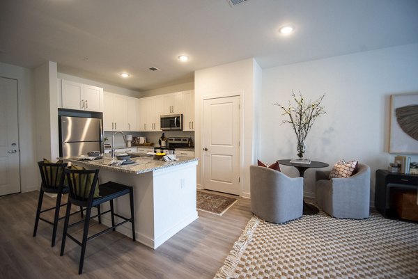 Spacious open-concept kitchen with modern appliances at The Whitby luxury apartments