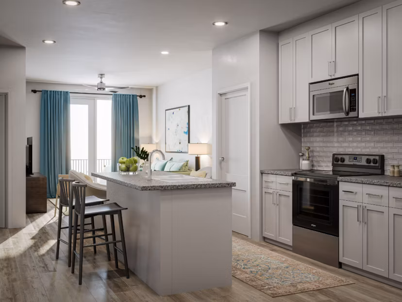 Modern kitchen with stainless steel appliances at The Whitby luxury apartments