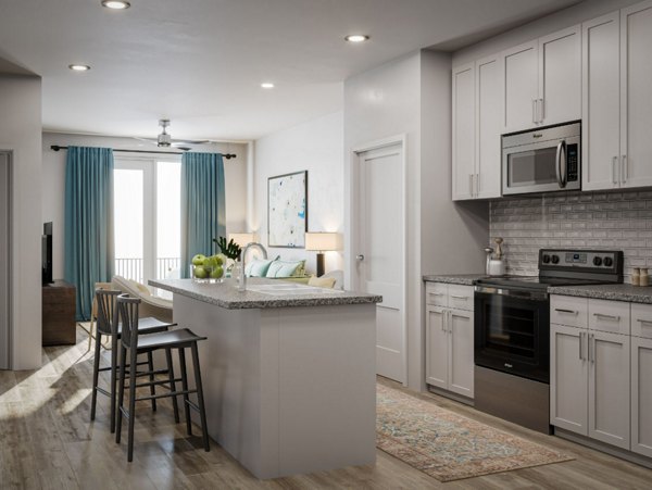 Modern kitchen with stainless steel appliances at The Whitby luxury apartments