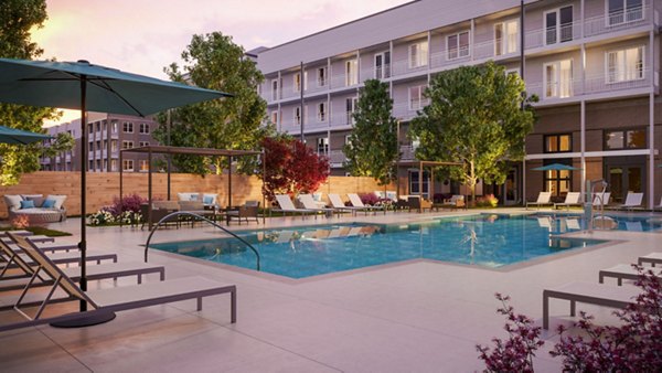 Inviting poolside lounge area at The Whitby luxury apartments, perfect for relaxing and socializing