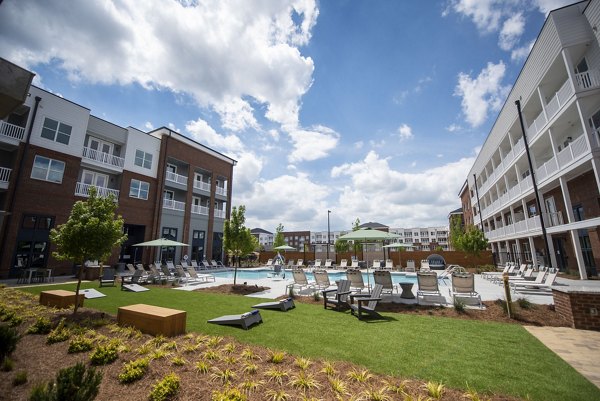 Rooftop lounge with modern seating and fire pit at The Whitby luxury apartments