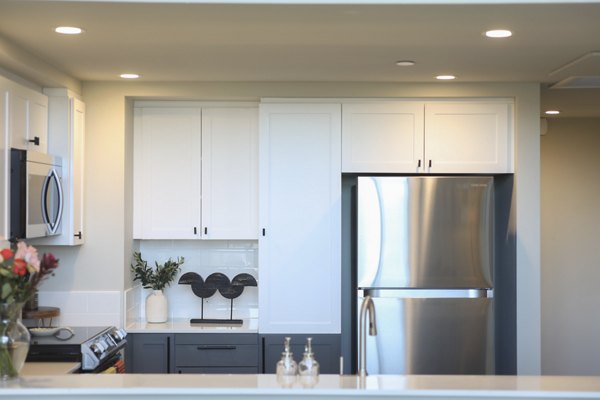 Modern kitchen with stainless steel appliances at 888 4th Street Apartments