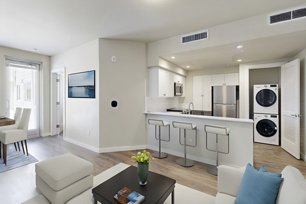 Spacious living room with modern decor at 888 4th Street Apartments, San Francisco, offering comfort and style for urban living