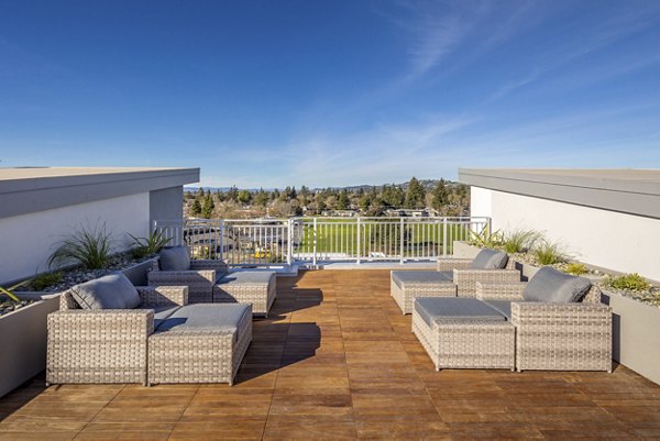 Outdoor patio area with modern seating at 888 4th Street Apartments