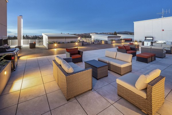 Chic patio with modern seating at 888 4th Street Apartments, ideal for relaxation and entertaining in a vibrant urban setting