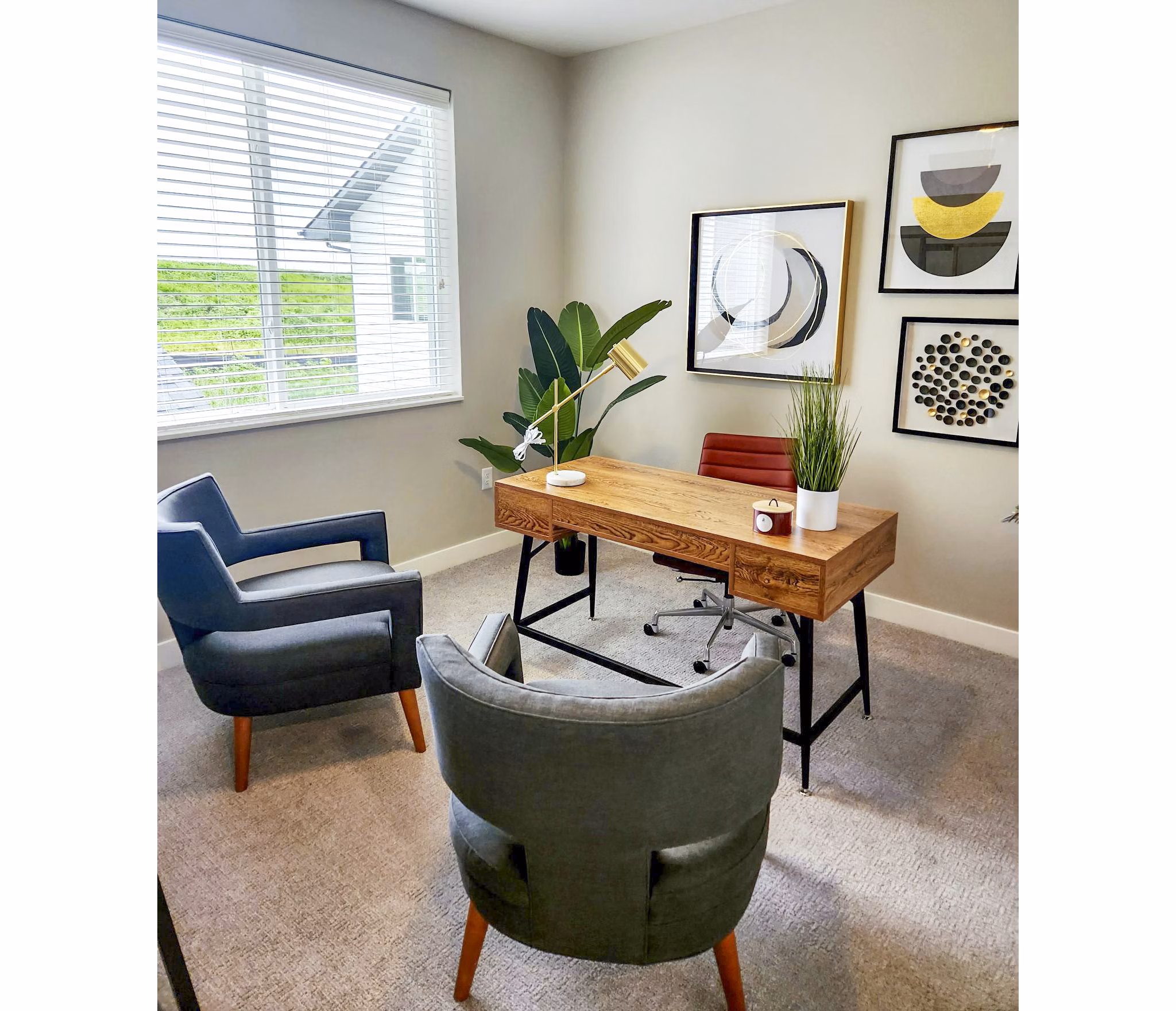Home office featuring a large desk and ergonomic chair in Vestara 72 Apartments, luxury rentals