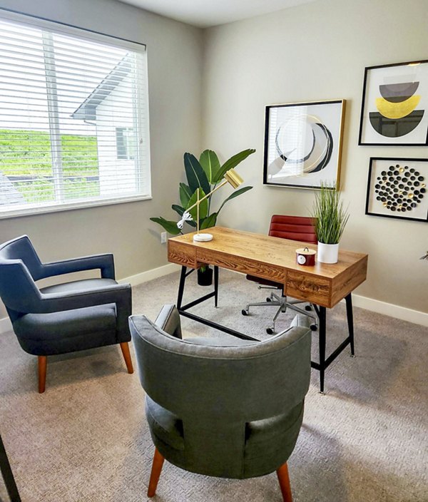 Home office featuring a large desk and ergonomic chair in Vestara 72 Apartments, luxury rentals