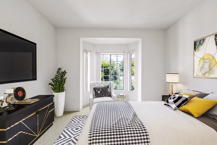 Cozy bedroom with stylish decor at Cahuenga Heights Apartments, offering luxury living in a prime location