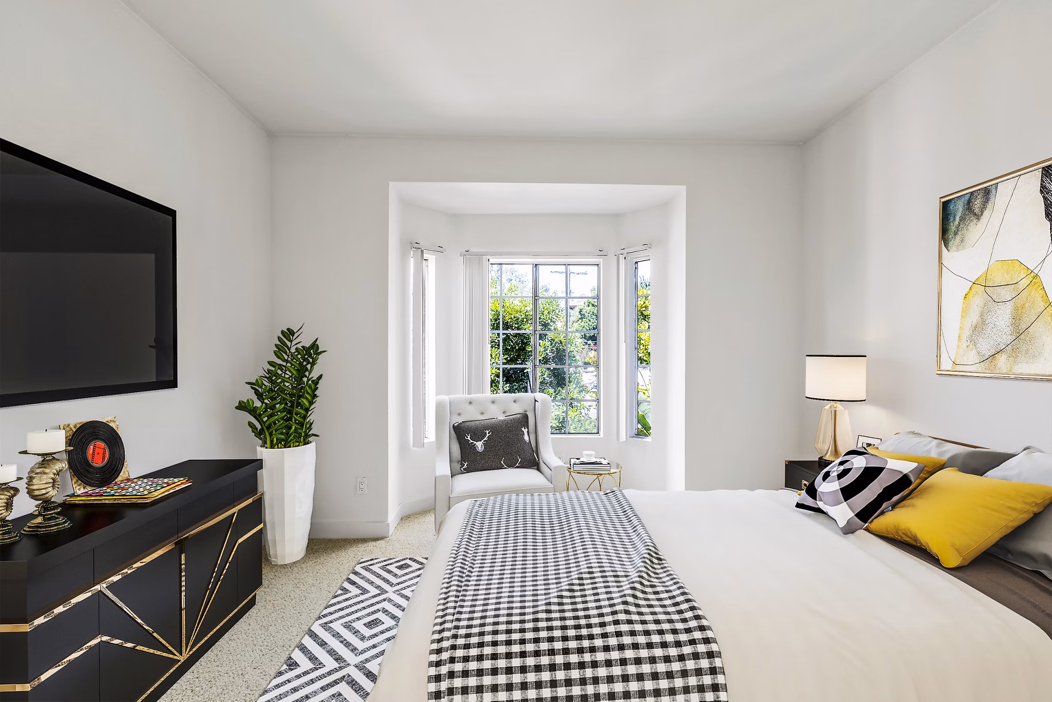 Cozy bedroom with stylish decor at Cahuenga Heights Apartments, offering luxury living in a prime location