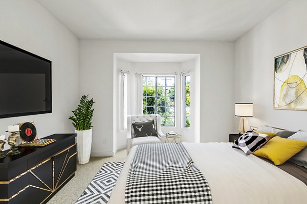 Cozy bedroom with stylish decor at Cahuenga Heights Apartments, offering luxury living in a prime location