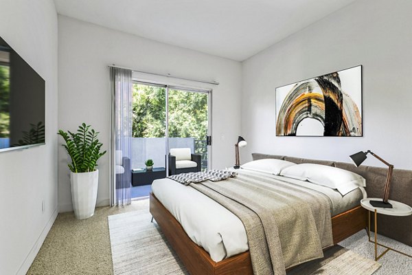Cozy bedroom featuring stylish decor at Cahuenga Heights Apartments