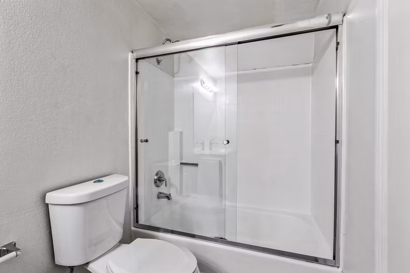 Modern bathroom with marble countertops and sleek fixtures in Cahuenga Heights Apartments