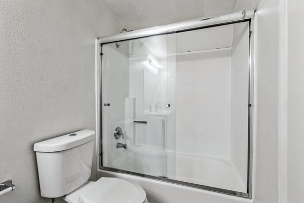 Modern bathroom with marble countertops and sleek fixtures in Cahuenga Heights Apartments